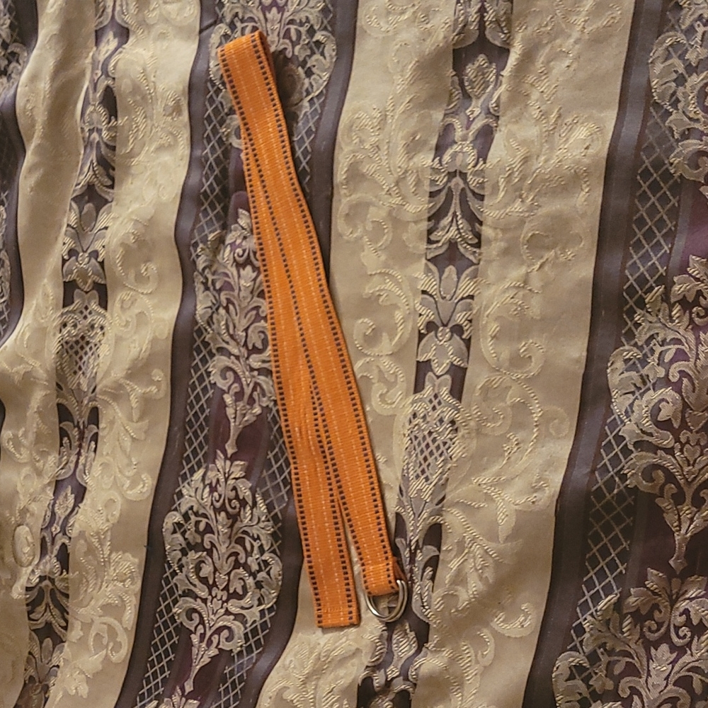 5/$25 Orange, white & blue belt size 1 with metal silver clasp